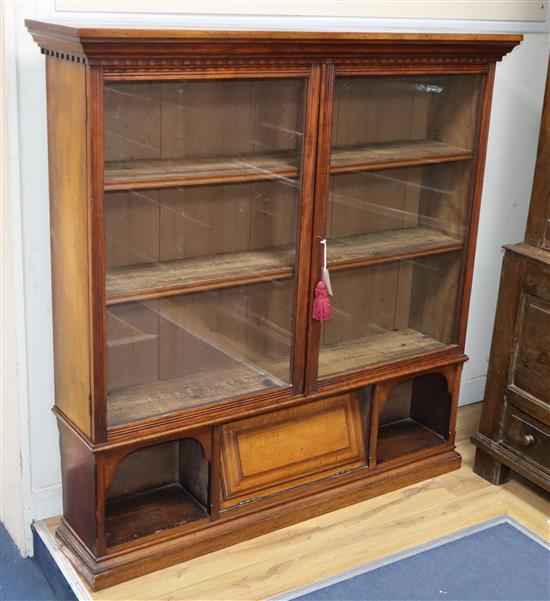 A late Victorian glazed walnut bookcase W.120cm